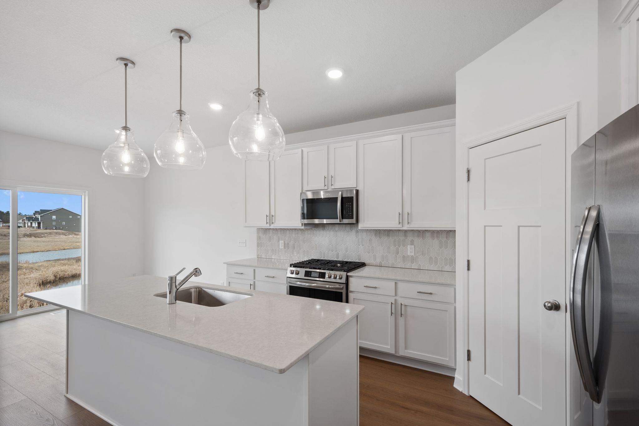 A corner pantry provides plenty of storage space for culinary essentials