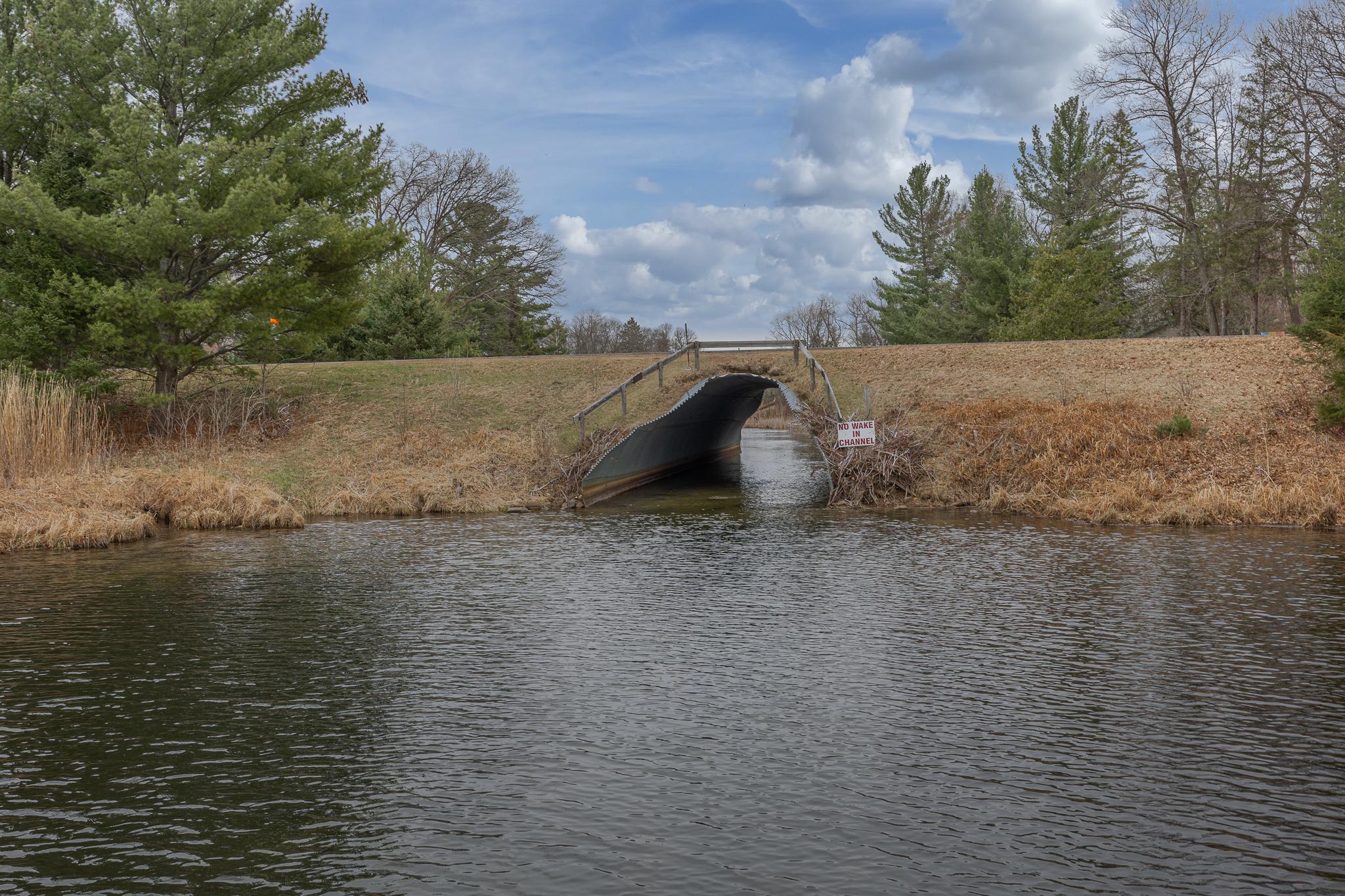 Go through the culvert in your boat or pontoon into Woman Lake