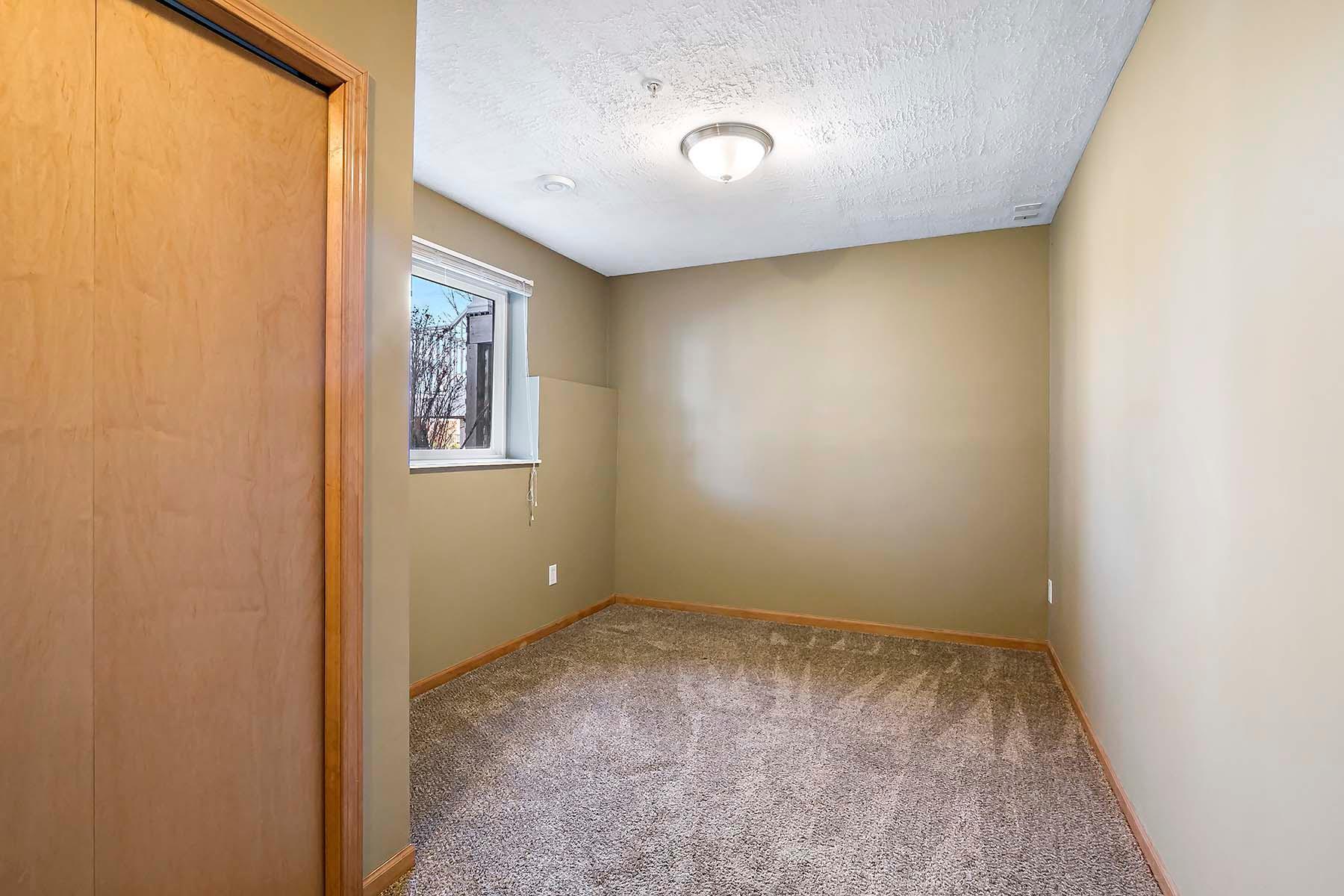 From a different angle, the lower level flex room with lookout windows - use the space to your liking.