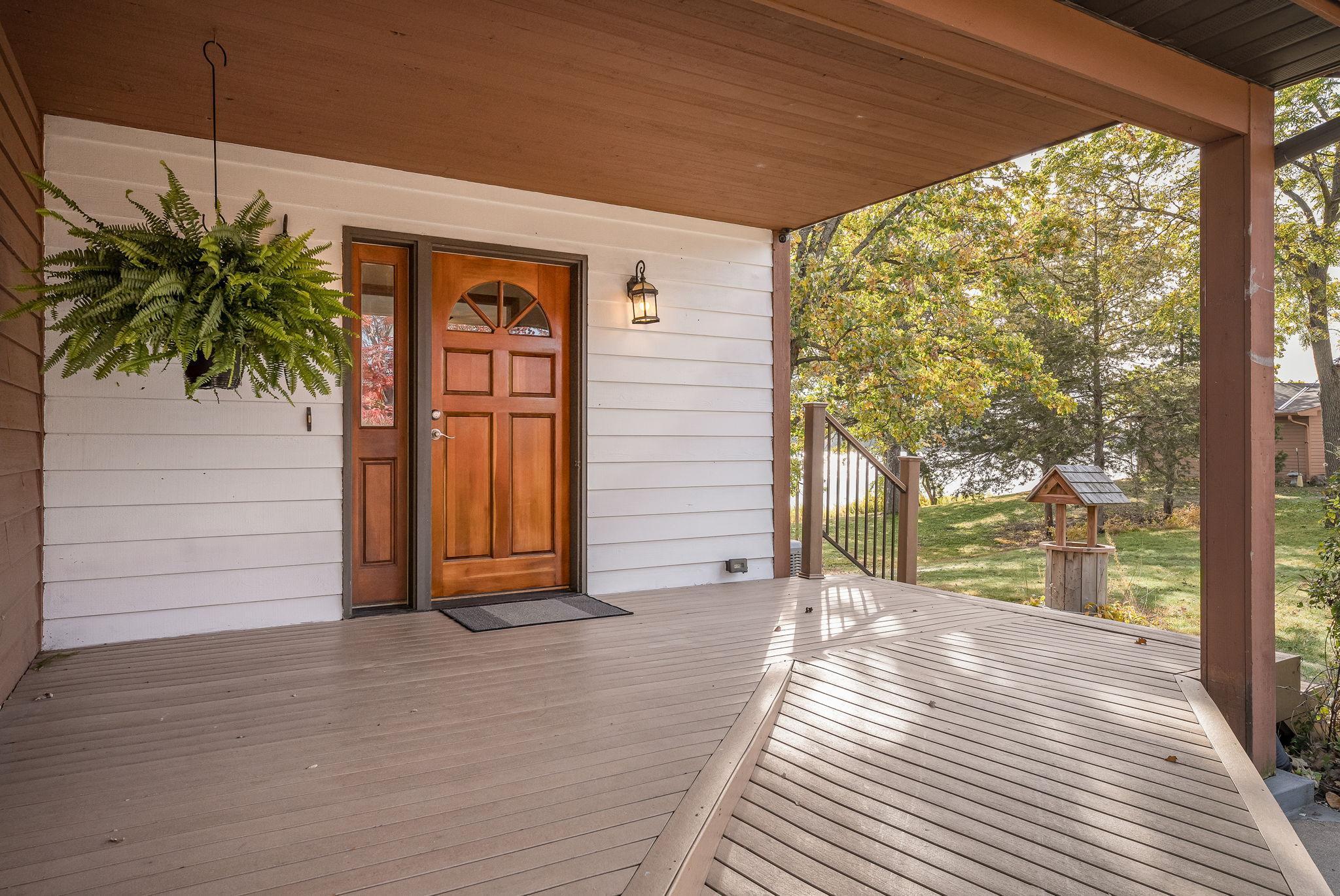 The welcoming front porch invites you in, complete with an accessible ramp for easy entry.