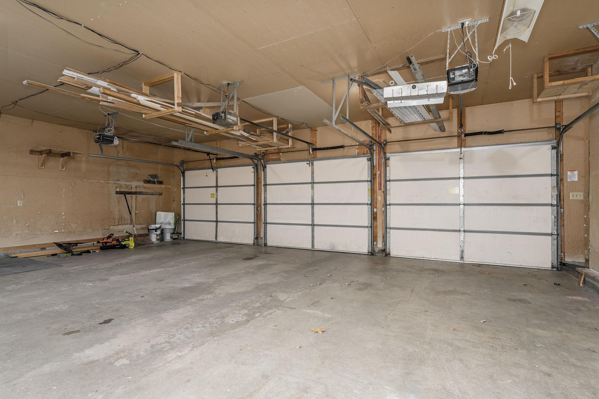 The oversized 3-car attached garage includes a separate access to the basement, making it an ideal setup for an up-and-down rental situation with a private entrance for added convenience and privacy.