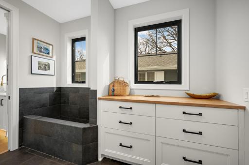 Pet wash off the mudroom and garage. Attached heated garage with EV p