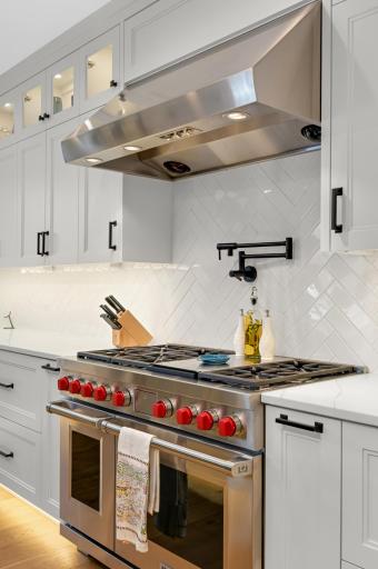 Gourmet chef kitchen with Wolf appliances and Sub-Zero refrigerator