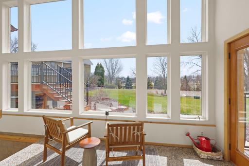 This atrium was added onto the home by the architect to enjoy the backyard views. Great for morning coffee and listening to the golf course wake up.