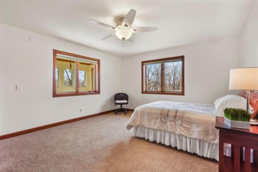 Large bedroom on same level with atrium views.