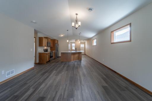 Bright and inviting living space with abundant natural light and durable LVP flooring.