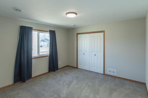 Versatile second bedroom perfect for guests, office, or hobby space.