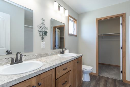 Generous walk-in closet providing excellent storage and organization.