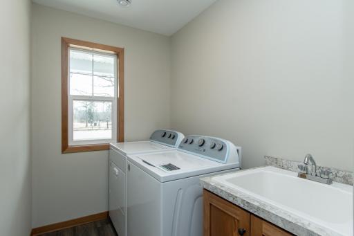 Convenient main-level laundry room designed for efficiency and ease of use.