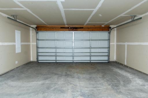 Attached garage offering secure parking and additional storage space.