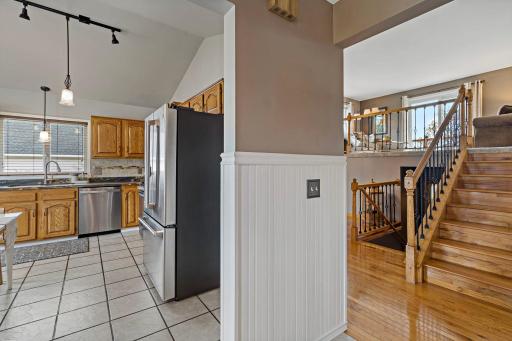 A hardwood stairwell offers a beautiful first impression, while the main-floor kitchen makes unloading groceries a breeze.