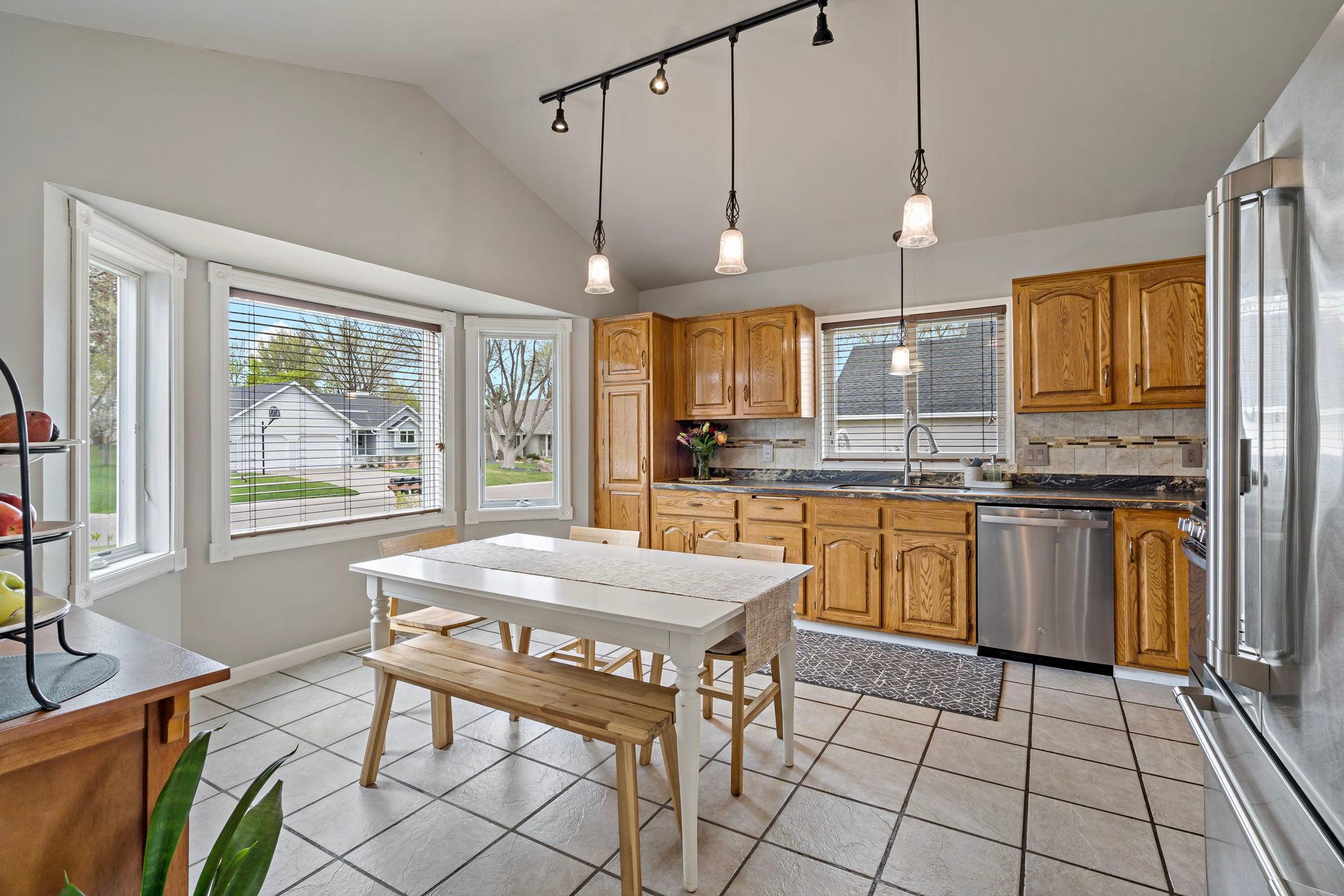 You will love this bright, airy kitchen with a beautiful view of those mature trees across the street.