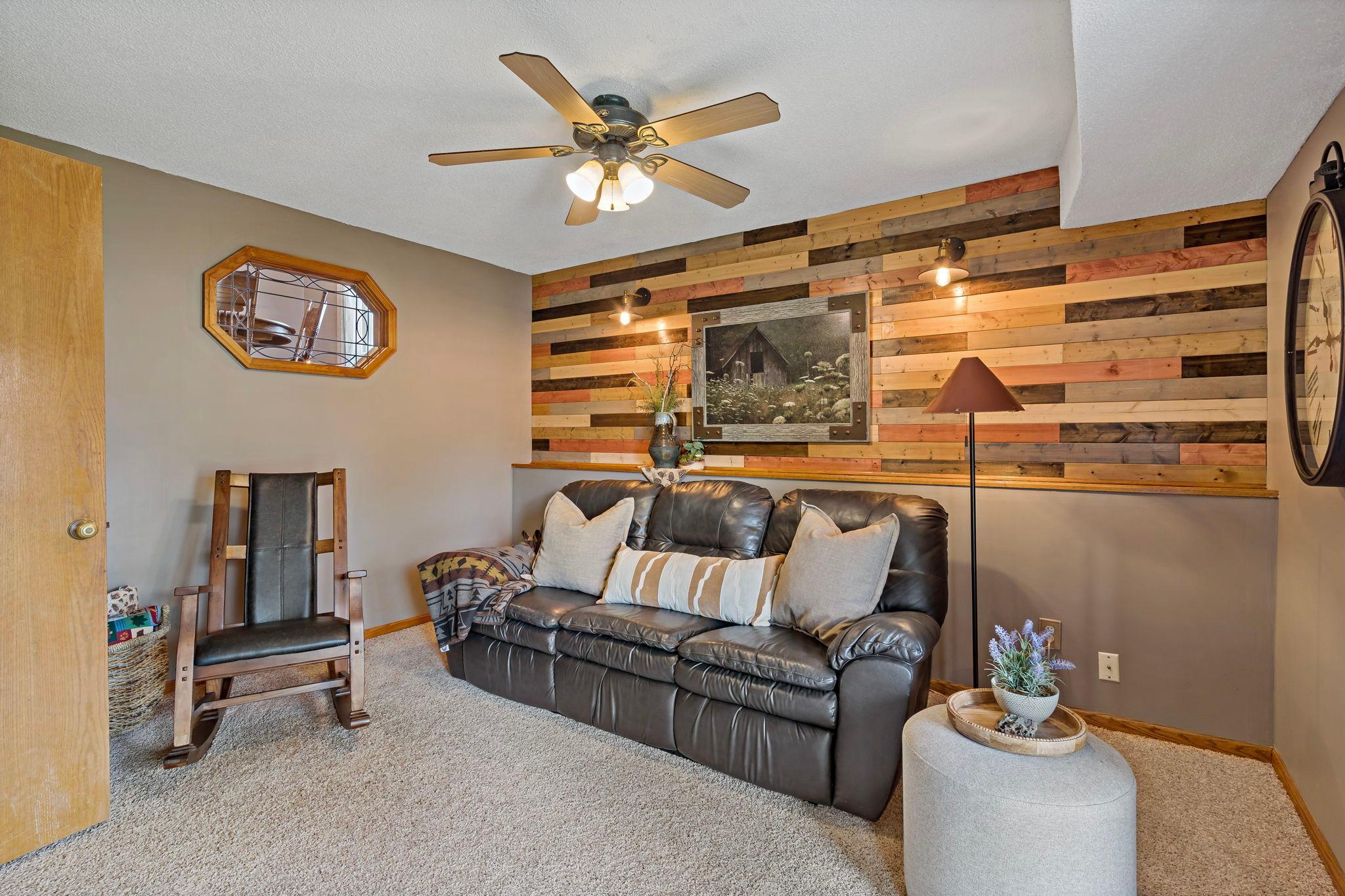 Lower level - the statement wall adds a touch of the "up north" feel but remains elegant.