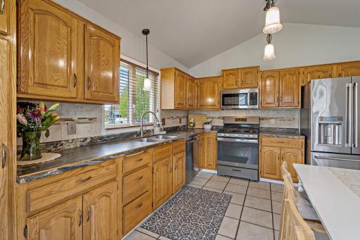 The vaulted ceilings pair beautifully with sturdy, original wood cabinetsâa timeless look for those who appreciate natural grain and solid construction.
