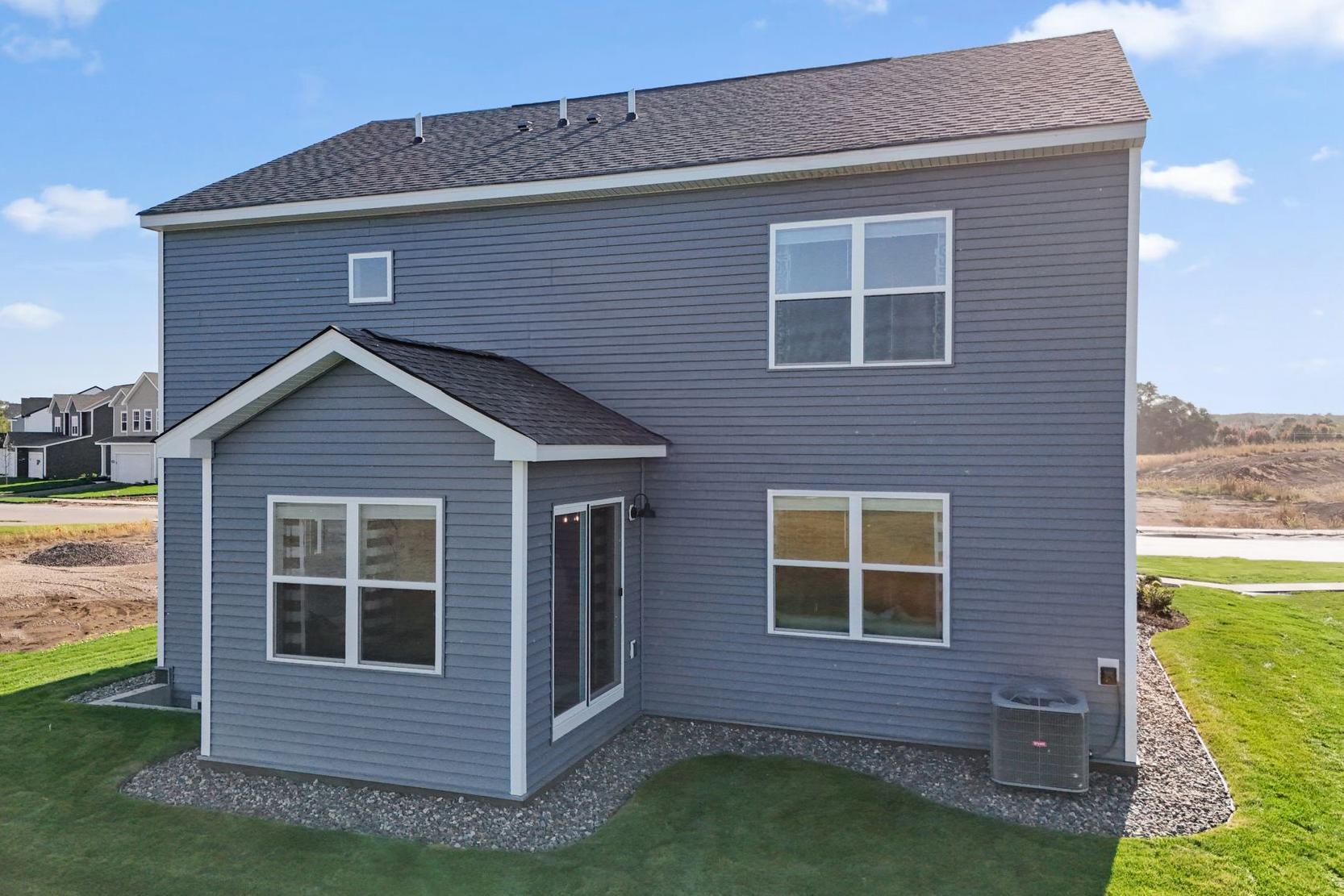 Exterior view with Morning Room- full basement, unfinished.