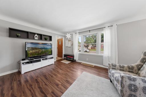 Expansive windows brighten the room with natural light.