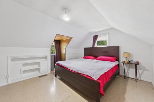 Spacious upper-level bedroom with a tranquil atmosphere.