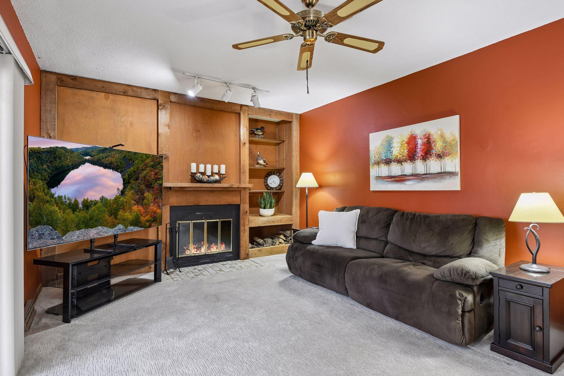 Main floor Family Room with wood burning fireplace.