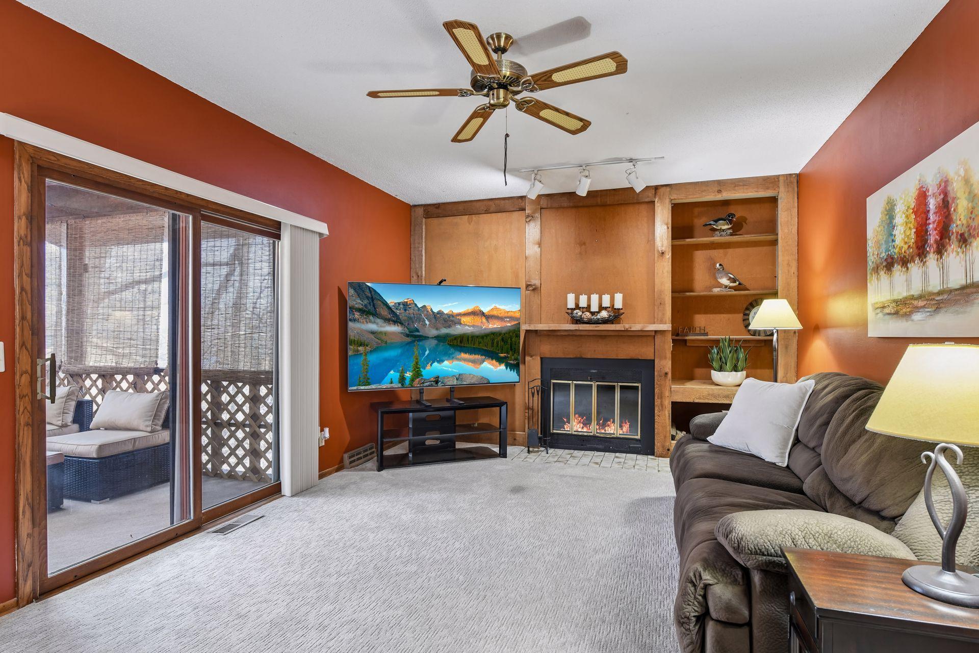 Warm, cozy family room with screen porch adjacent.
