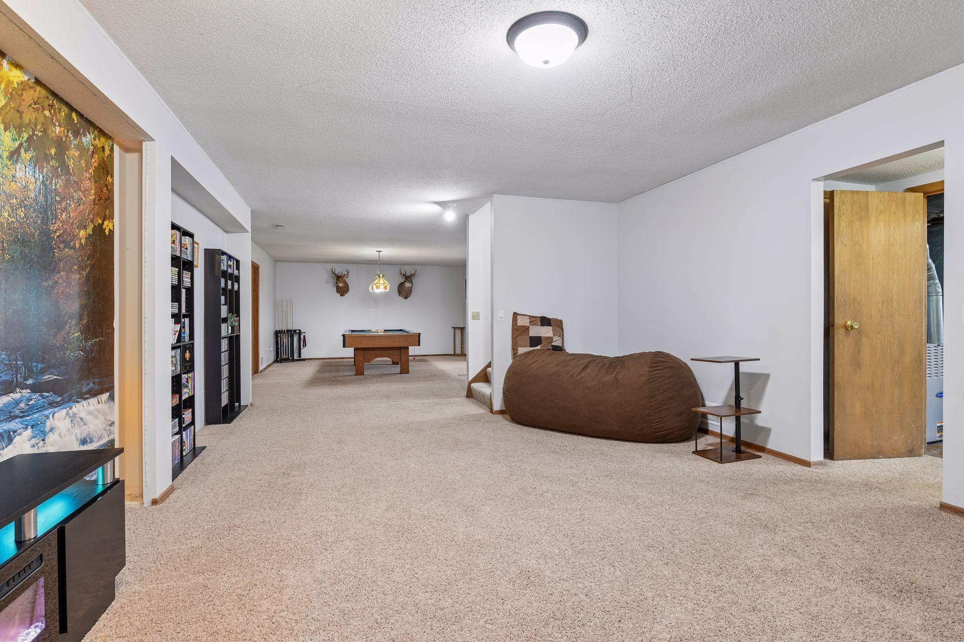 Media Room, Pool Table area and Family Room all flow seamlessly together.