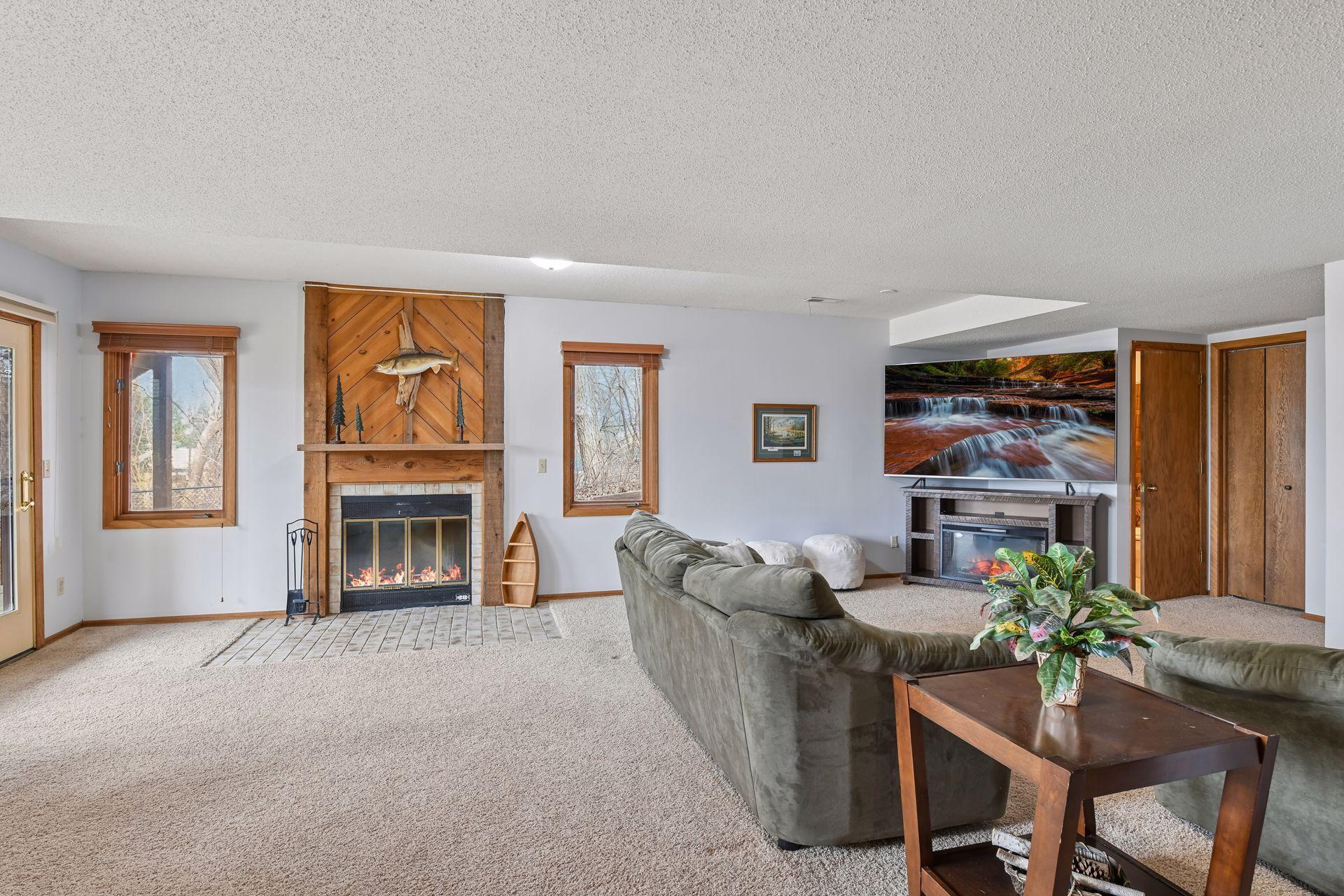 Lower level Family Room - wood burning fireplace.