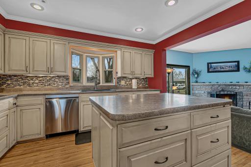 Featuring a center island with additional drawers and cabinet storage.