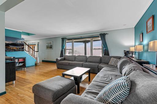 Hardwood floors in the living room and a large picture window that fills the living room with natural light.