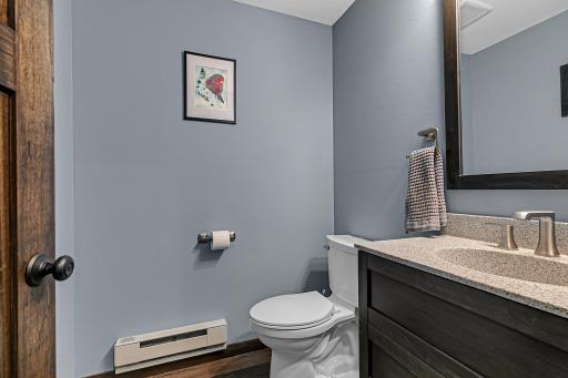 Neat and tidy half bath on the main level for guests.