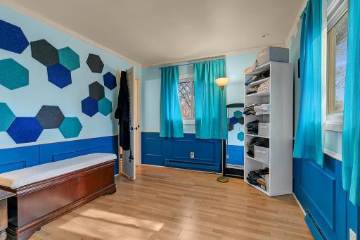 The suite features double closets and a unique adjoining sitting room, perfect as a reading retreat or easily converted into a large walk-in closet.