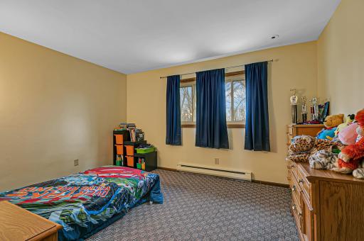 Upper level bedroom â bringing the total to four upper level bedrooms with includes the private primary suite.