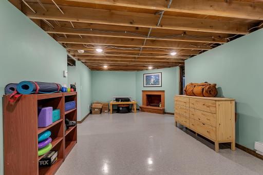 This is part of the additional 688 square feet that is ready to be finished simply by completing the ceiling. New drywall, trim, and flooring already enhance much of the space.