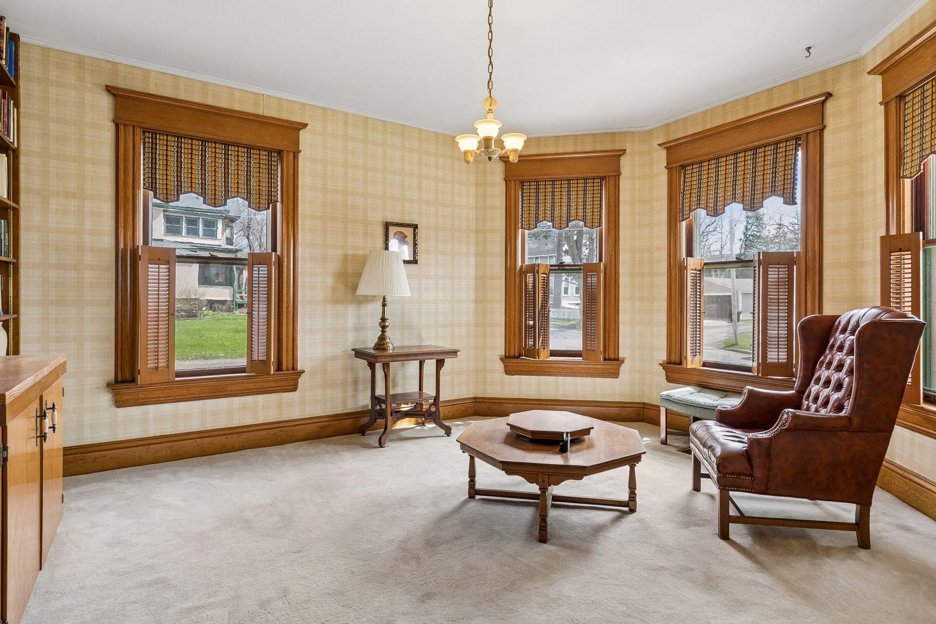 To your right of your entry is the parlor. Seamlessly blended Inlaid, parkay and hardwood flooring spanning through the main floor