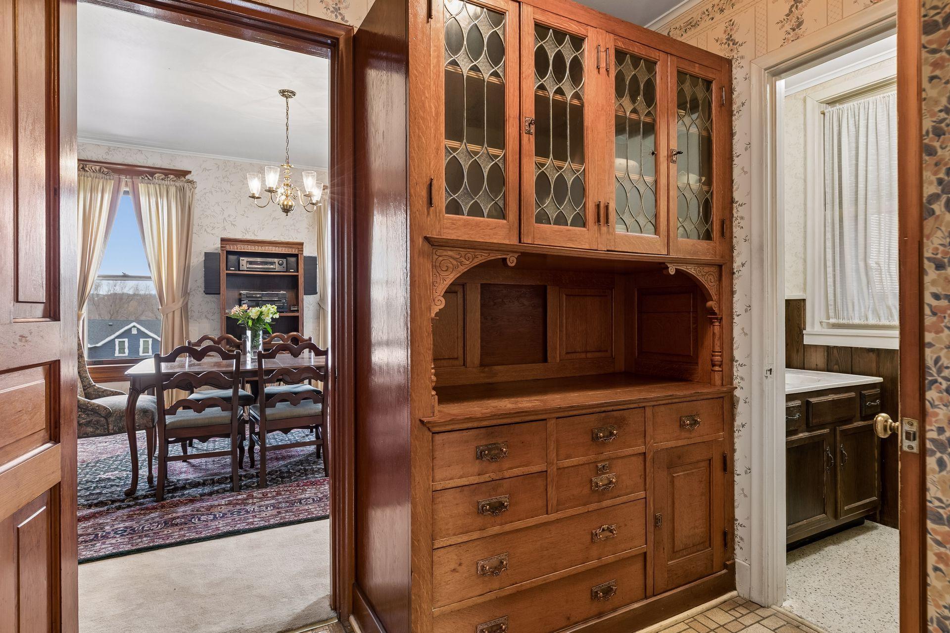 Large Butler's pantry with a 1/2 bath off to the side, located between the formal dining room and kitchen