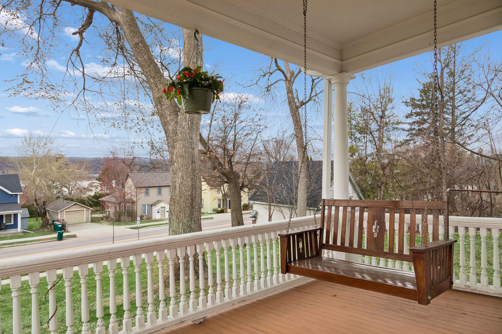 Porch wraps around to the west side of the home