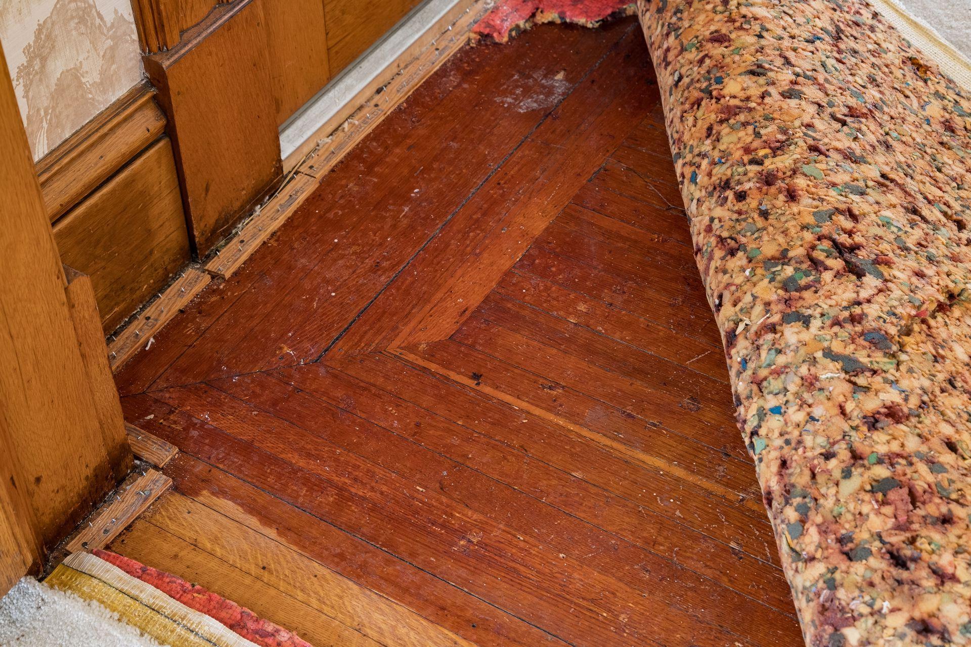 Original inlaid hardwood floors under the carpeting, served as a protective layer, keeping the authentic floors in good condition