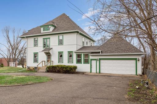 Sideview showcasing circular drive, for plenty of off-street parking. Two-car attached garage