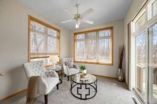 A bright and inviting sunroom filled with natural light, offering the perfect spot to relax and unwind.