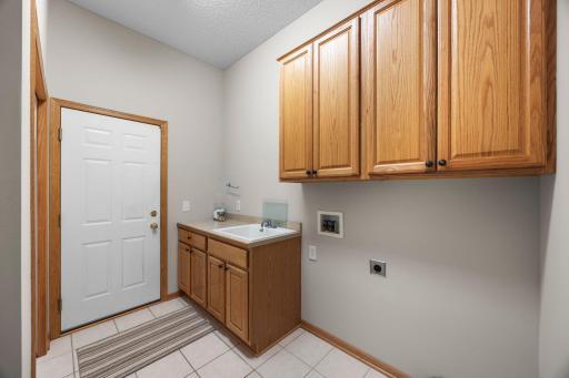 A conveniently located laundry room provides practical main-level ease.