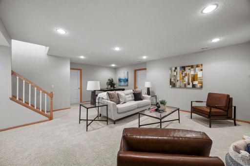 The finished lower level adds even more living space with a large family room perfect for movies, hobbies, or hosting guests.