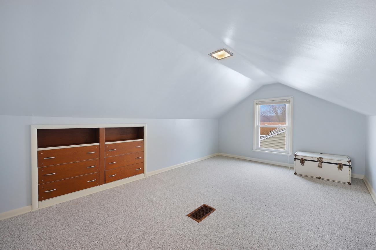 Upper level bedroom with built in cabinets