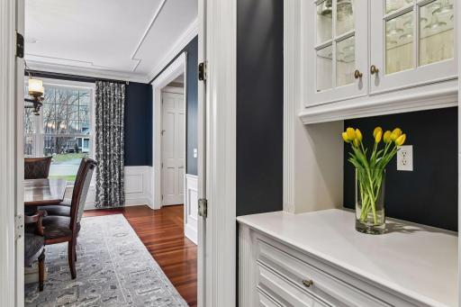 Butlers pantry between the kitchen and formal diningroom