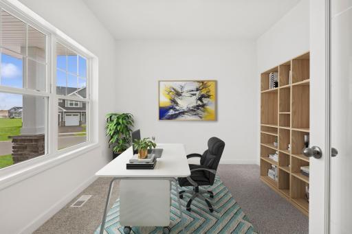 (Photo of a decorated model, actual finishes will vary) This main level study provides a perfect setting for those working from home or completing a school project.