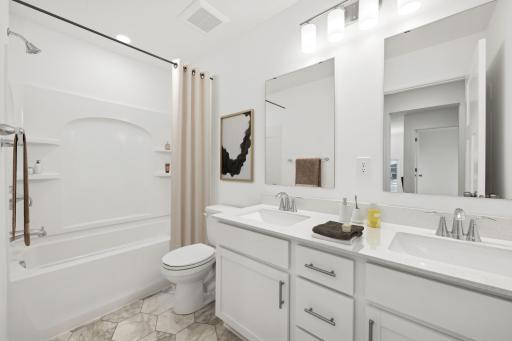 (Photo of a decorated model, actual finishes will vary) Featuring a double vanity, this secondary bath is sure to keep everyone moving during those busy mornings!