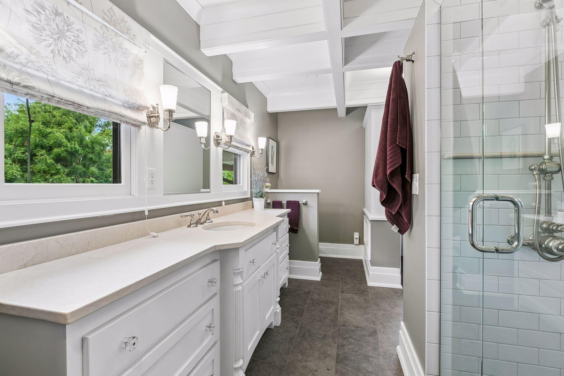 Gorgeously updated bathroom with separate walk-in shower and tub