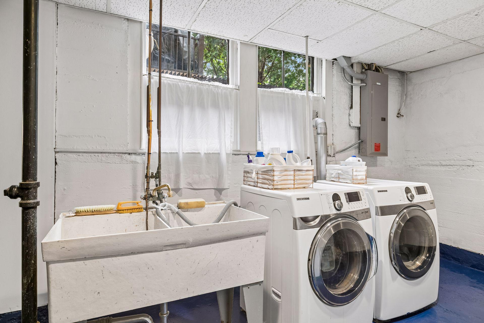 Who expected a basement laundry room to have so many large windows?