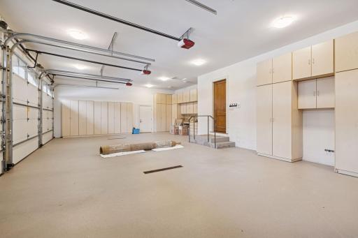 Four car heated garage with ample storage. Dedicated enclosed area for secure package pick-up and drop-off.