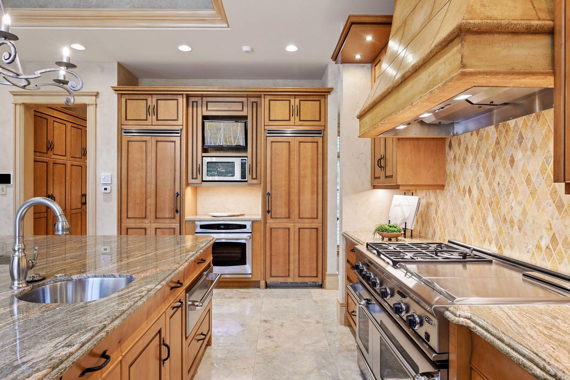 Beautiful Maple cabinets house the Viking Refrigerator and Freezer.