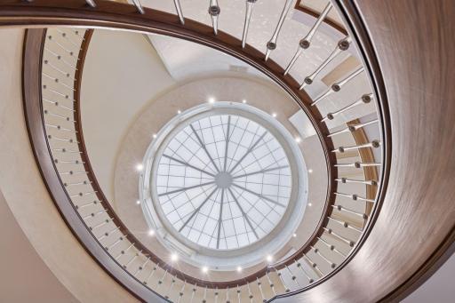 Glass cupola adorns the foyer flooding the home with soft natural light.