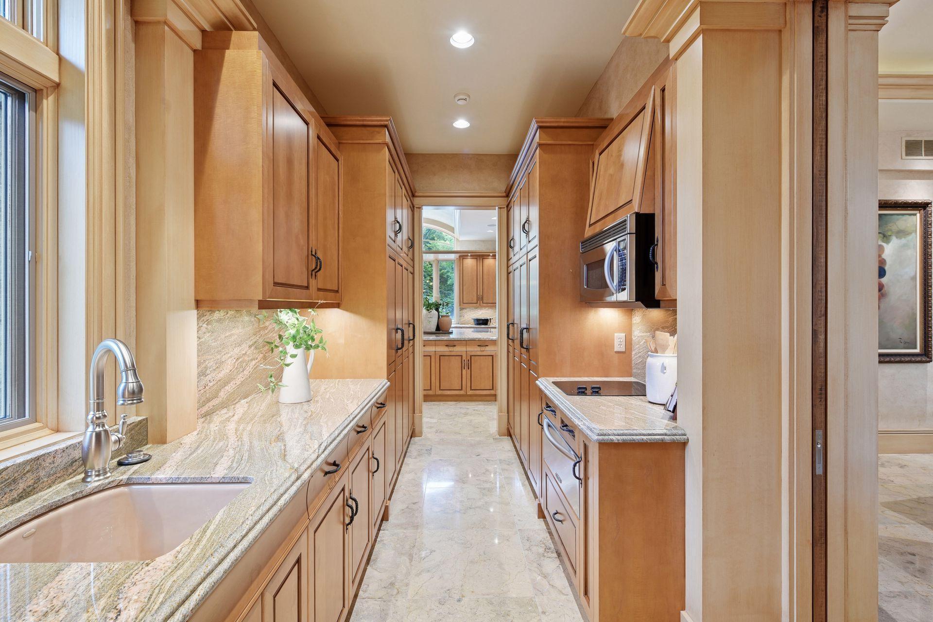 Butler’s pantry perfectly situated between the kitchen, dinette, and formal dining room.