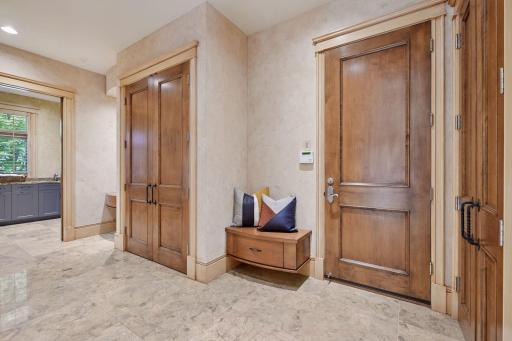 Back entry with abundant closet space. All closets have lights that turn on when you open the doors.